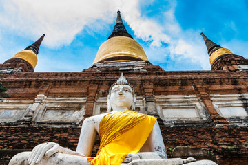 Fototapeta premium Buddha statues at Wat Yai Chai Mongkol in Ayutthaya, Thailand