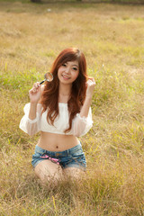Obraz premium Pretty Asian woman happy with the magnifying glass .