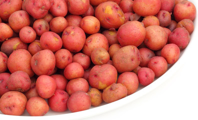Small Red Potatoes on a bowl over white background