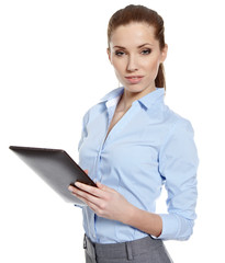 Businesswoman standing in hall with electronic pad