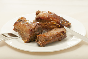 spareribs cooked in mustard and honey sauce