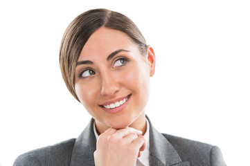 Closeup portrait of beautiful woman thinking while smiling over