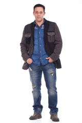 Naklejka premium man standing with hands on pocket