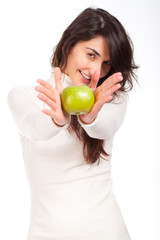 woman holding a green happy between hands and smiling