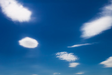 Naklejka na ściany i meble Fluffy clouds in a blue sky