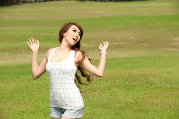 Pretty Asian woman casting her hair in posing .