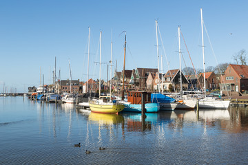 Fototapeta premium Sailing boats in Dutch harbor of Urk