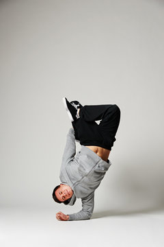 breakdancer standing on his elbow