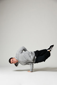 cool b-boy standing on one hand