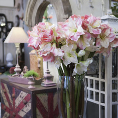 Flowers composition in retro interior. Lily