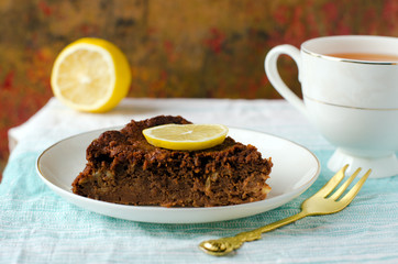 A piece of chocolate cake with lemon