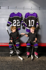 Fototapeta premium Youth Hockey Players in Fist Pump
