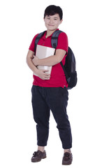 Fototapeta premium Smiling teenager with a schoolbag standing with white background