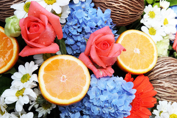 orange fruit and blooming flower