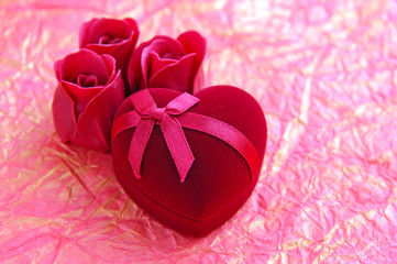 Red velvet Heart-shaped Gift Box on a background wrapping paper