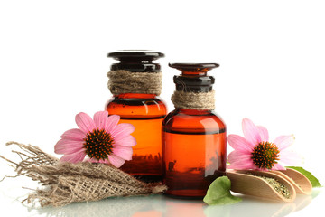 medicine bottles with purple echinacea , isolated on white