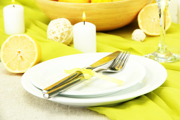 beautiful holiday table setting with lemons, close up