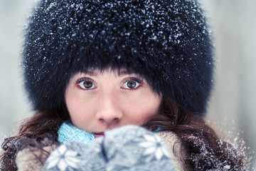 Close-up portrait of beautiful winter woman