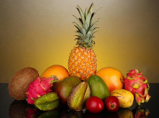 Composition of exotic fruits on colorful background