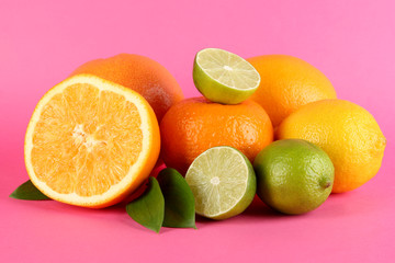 Fruits with leafs on pink background