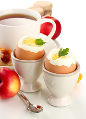 Light breakfast with boiled eggs and cup of coffee, isolated