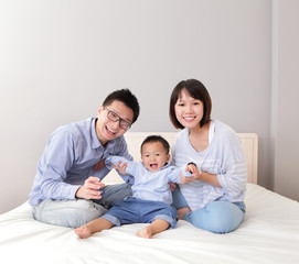 happy family play on bed