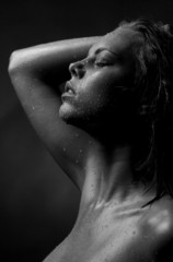 Portrait of a girl's face which water flows