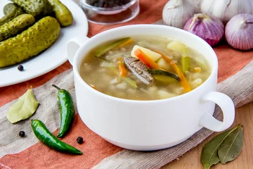 Foto op Aluminium Meat soup with pickled cucumbers and  pearl barley © maria_lapina