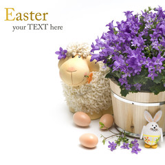 Easter sheep with easter decoration and flowers