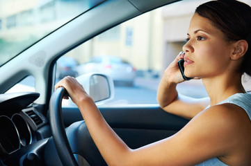 Fototapeta na wymiar driving phone woman