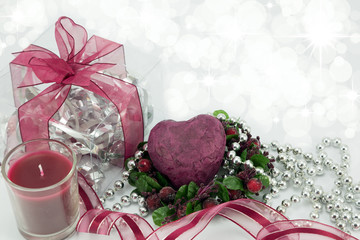 Deep red heart with gift,candle and ribbon.