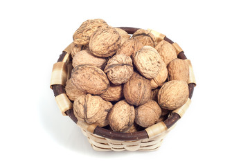 basket of nuts, autumn fruits, isolated on white