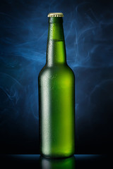 Bottle of beer on blue