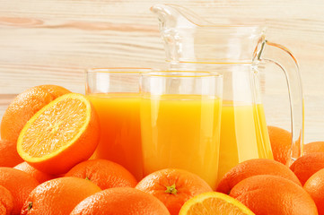 Composition with two glasses of orange juice and fruits