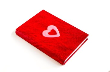 red notebook and pink heart