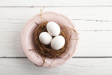 Close-up of  white easter eggs in nest