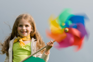 Summer joy - girl with colored pinwheel