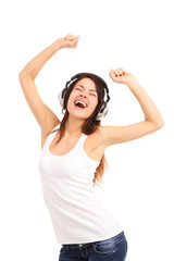 Obraz na płótnie Canvas Woman with headphones listening music on player