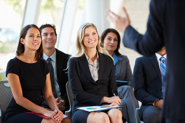 Audience Listening To Presentation At Conference