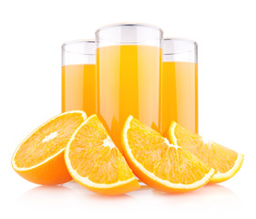 Orange juice in glasses with oranges