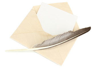 Old envelope with blank paper and feather isolated on white