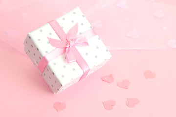Beautiful romantic gift box on pink background