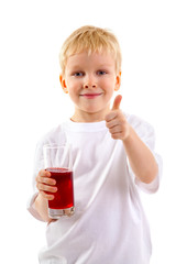 Little boy with a glass of juice