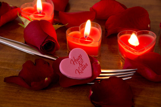 Valentine candles with rose petals