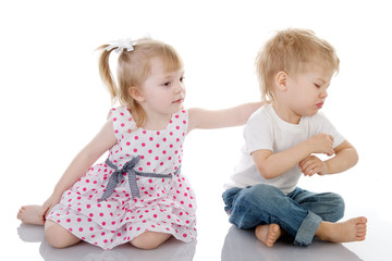 little girl calm the boy. isolated on white