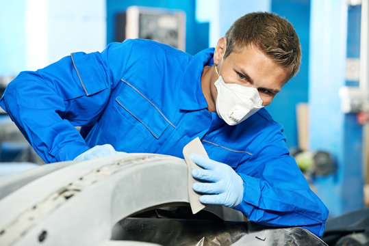 auto mechanic polishing car