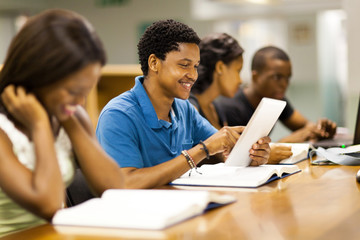 african american college student using tablet computer