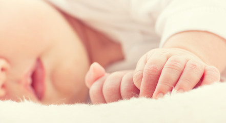 hand of sleeping baby newborn close up © JenkoAtaman