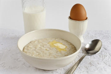 porridge from oat flakes, egg and a milk glass