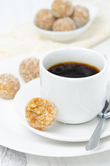 Homemade candy made of almonds, ginger and dates